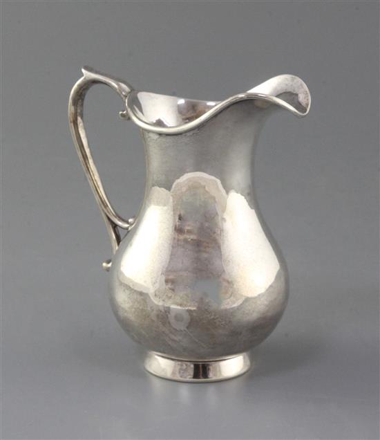 A modern silver cream jug by Rodney C. Pettit, 10 oz.